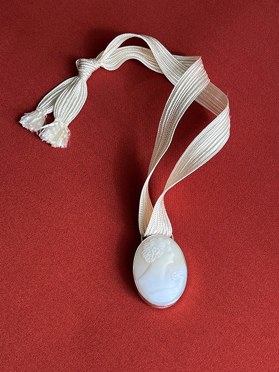 Cameos on cord necklace