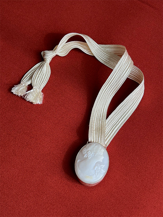Cameos on cord necklace