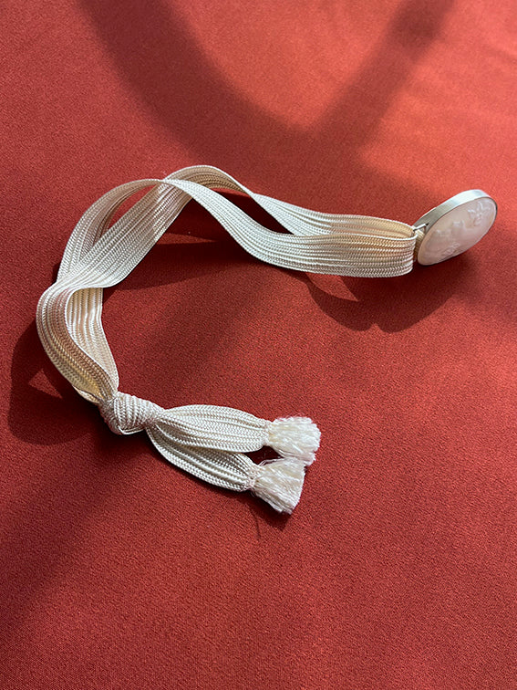 Cameos on cord necklace
